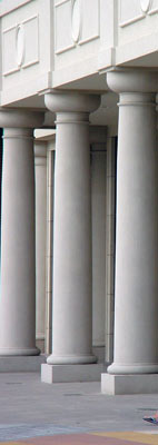 Three tapered Doric order columns. 